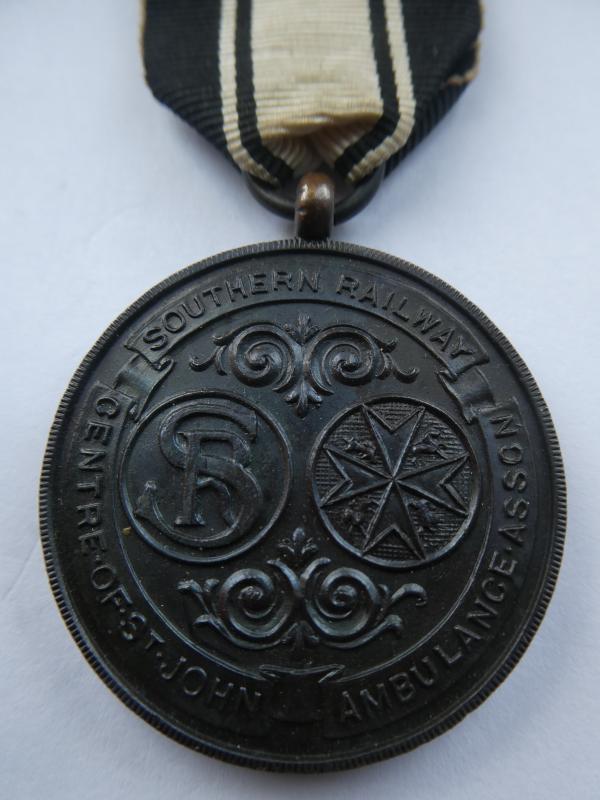 SOUTHERN RAILWAYS CENTRE OF ST.JOHN AMBULANCE ASSOCIATION BRONZE MEDAL WITH 7 YEARS CLASP-NAMED TO: KENNETH WALTON 1932