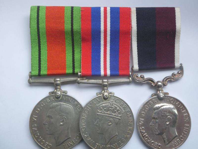 LONG SERVICE GROUP PF THREE TO ACTING FLIGHT LIEUT EDWARDS R.A.F. (LATER SQUADRON LEADER)